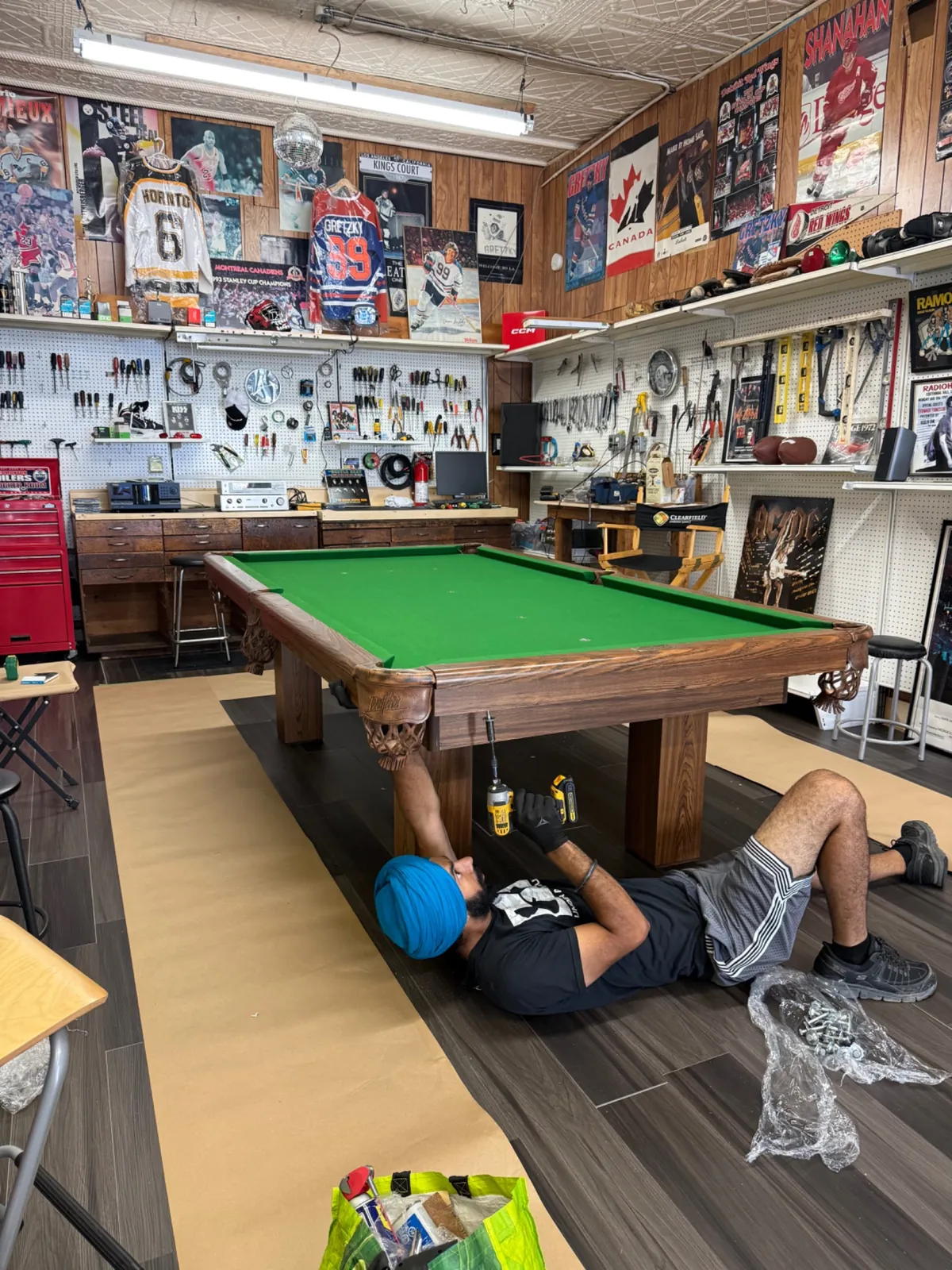 Gypsee Movers technician assembling a pool table