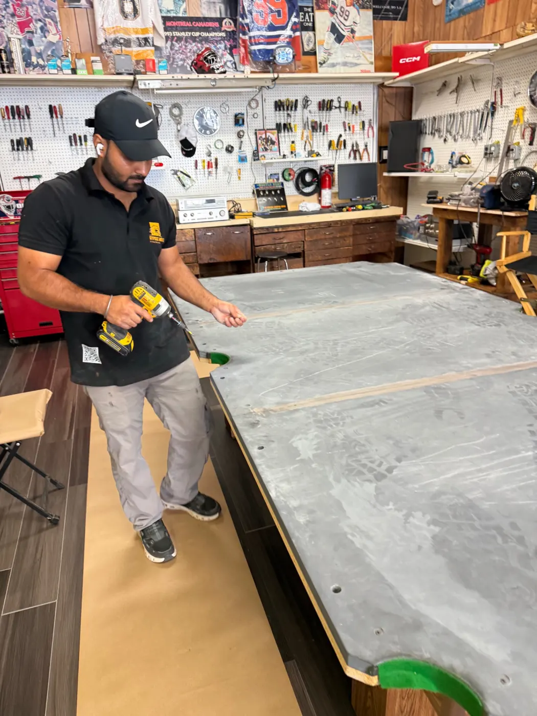 Fasteners removed from pool table slate