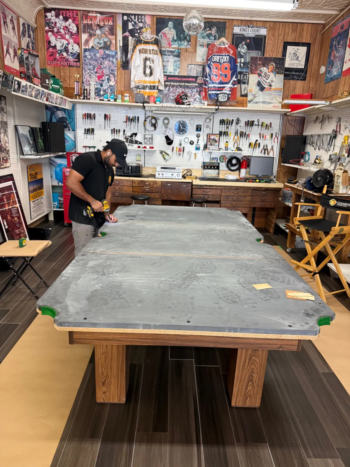Pool table slate exposed during professional disassembly