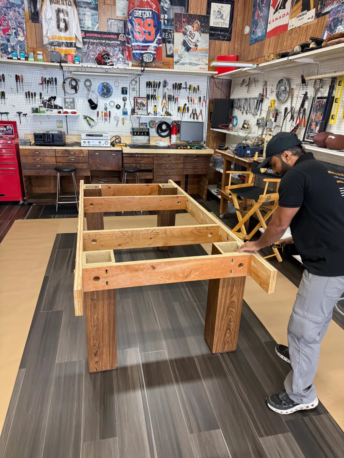 Pool table frame inspected during installation