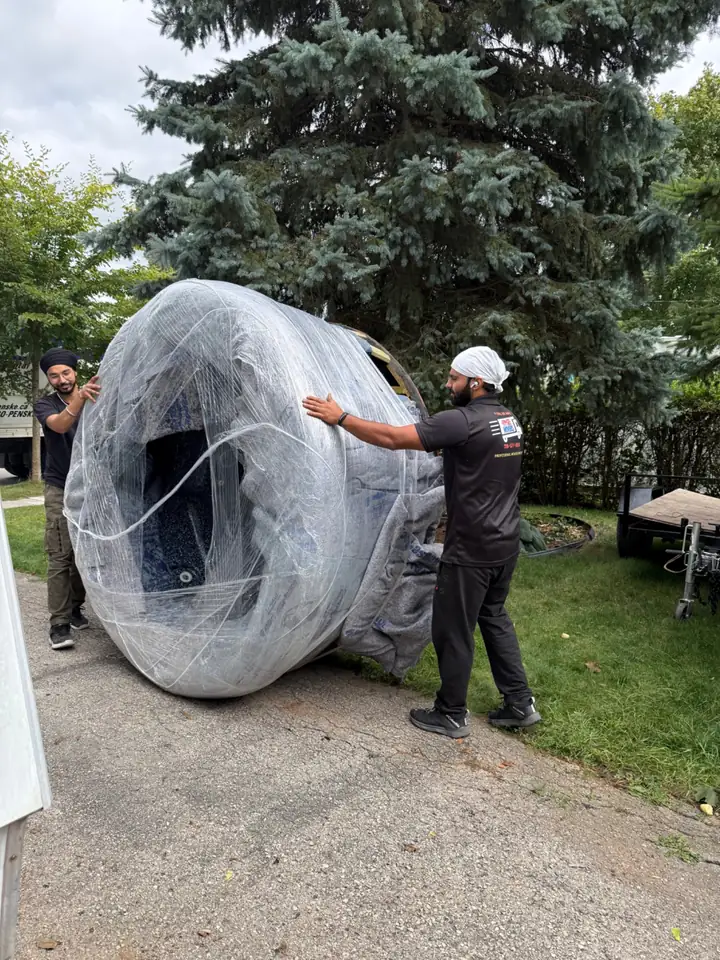 Gypsee Movers crew reviewing hot tub access and moving route
