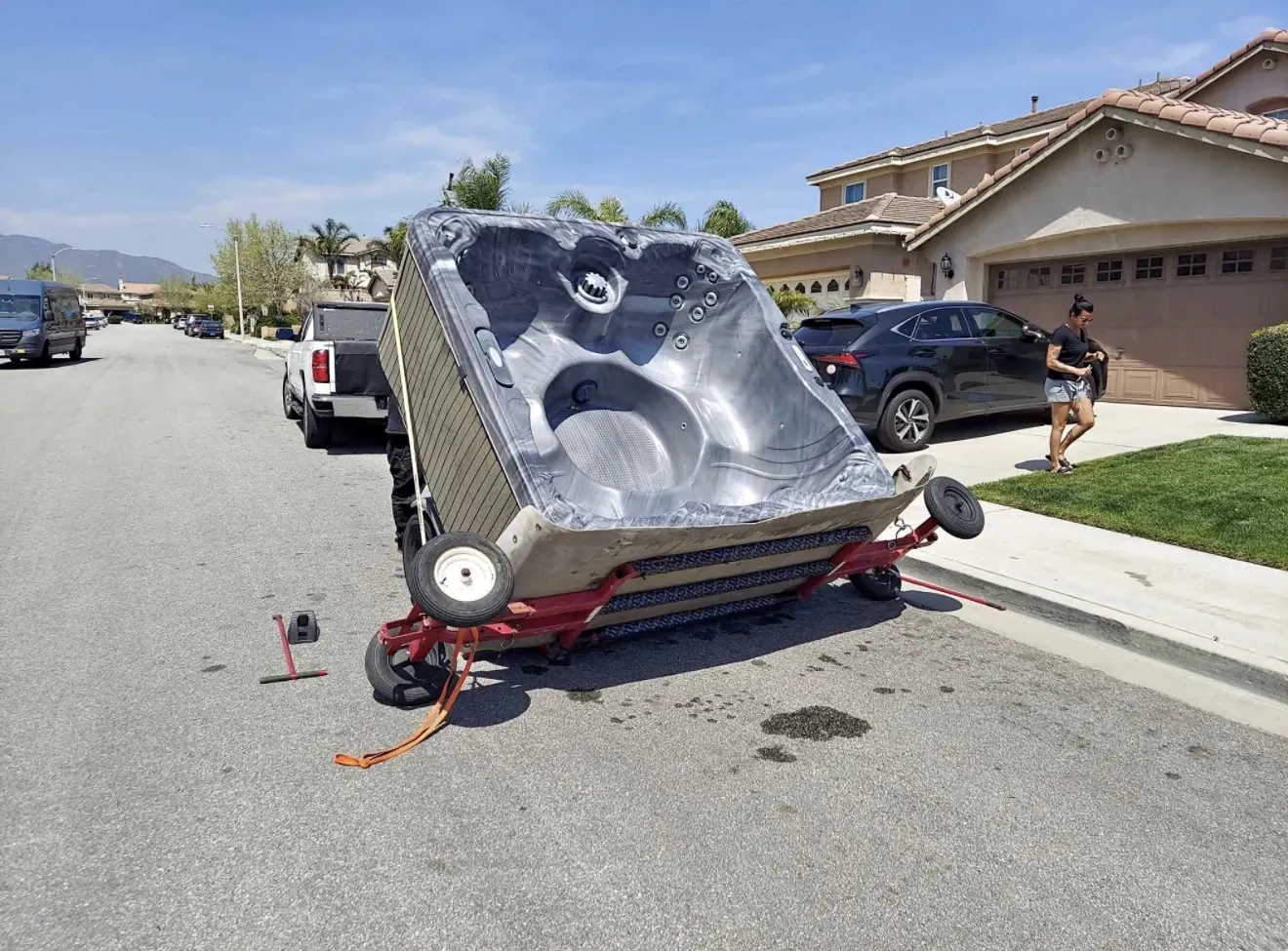 Hot tub placed sideways on a moving dolly