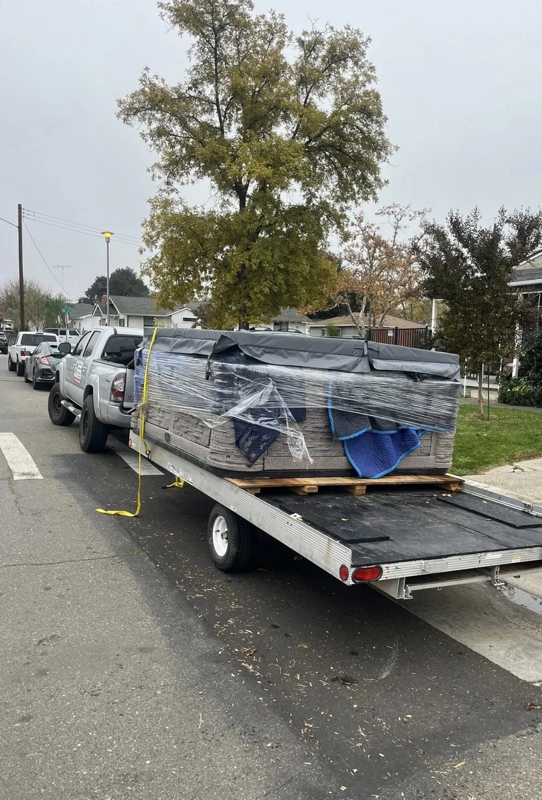Hot tub loaded onto a moving trailer