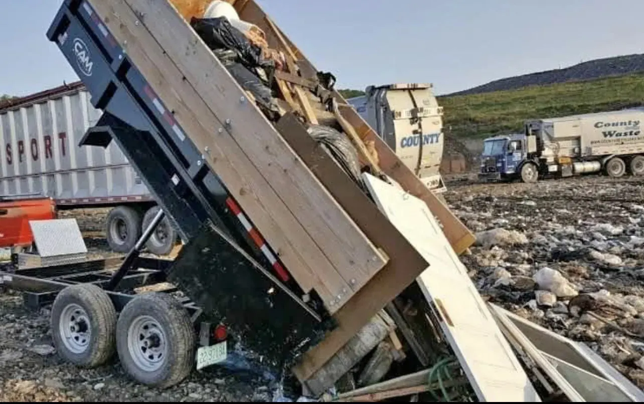 Dump trailer unloading renovation debris