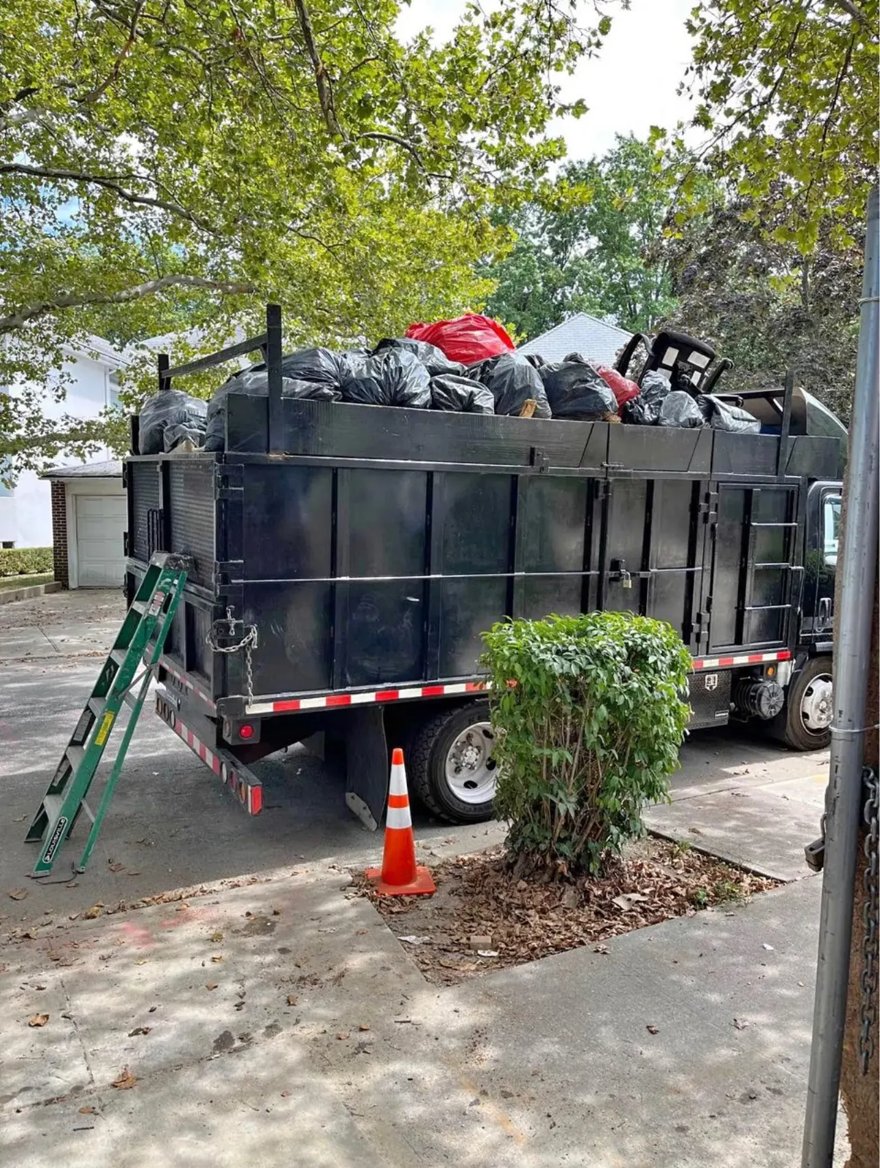 Dump truck loaded with junk bags