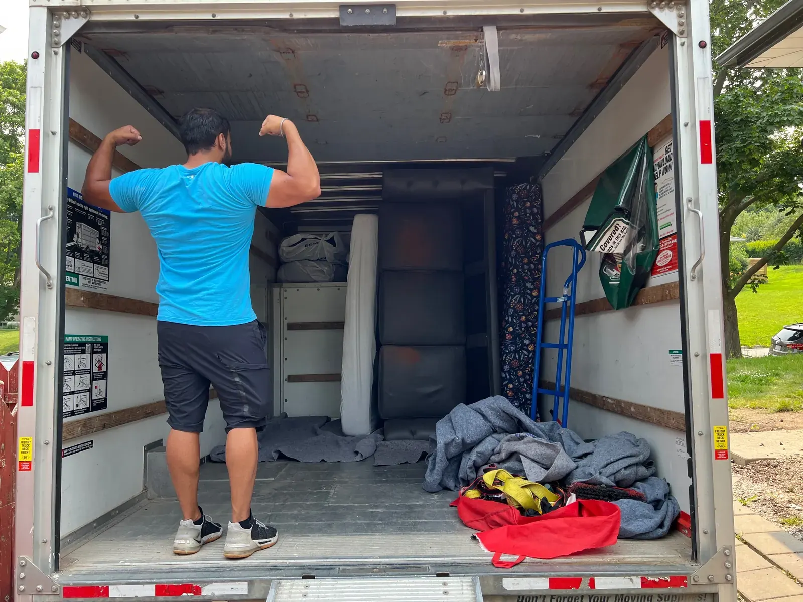 Gypsee Movers team loading junk into a moving truck in London Ontario