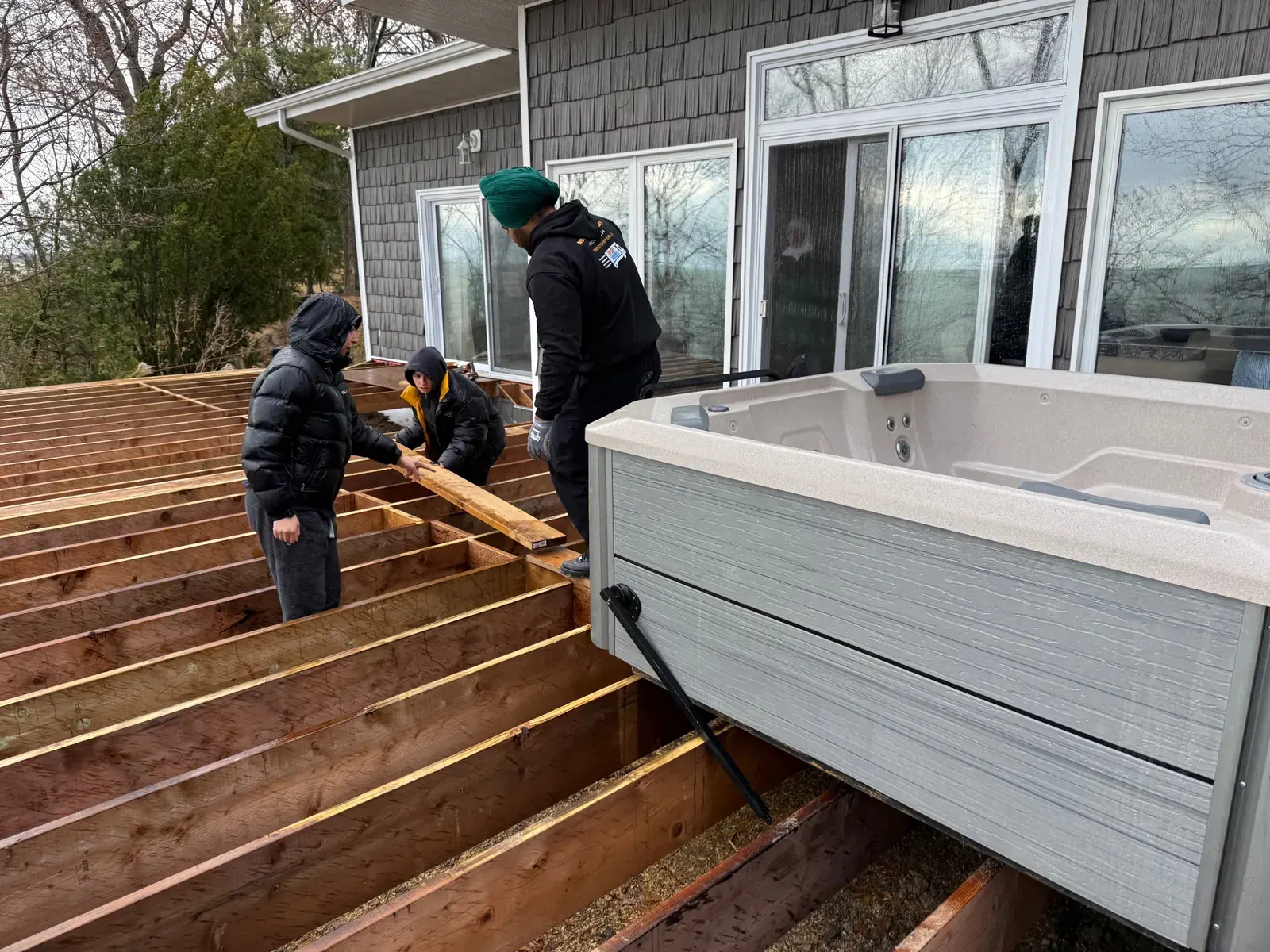 Hot tub removal service on a deck