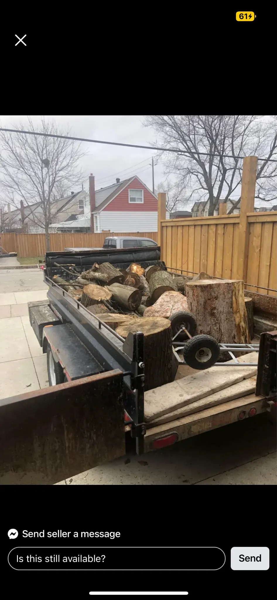 Trailer loaded with yard waste and logs