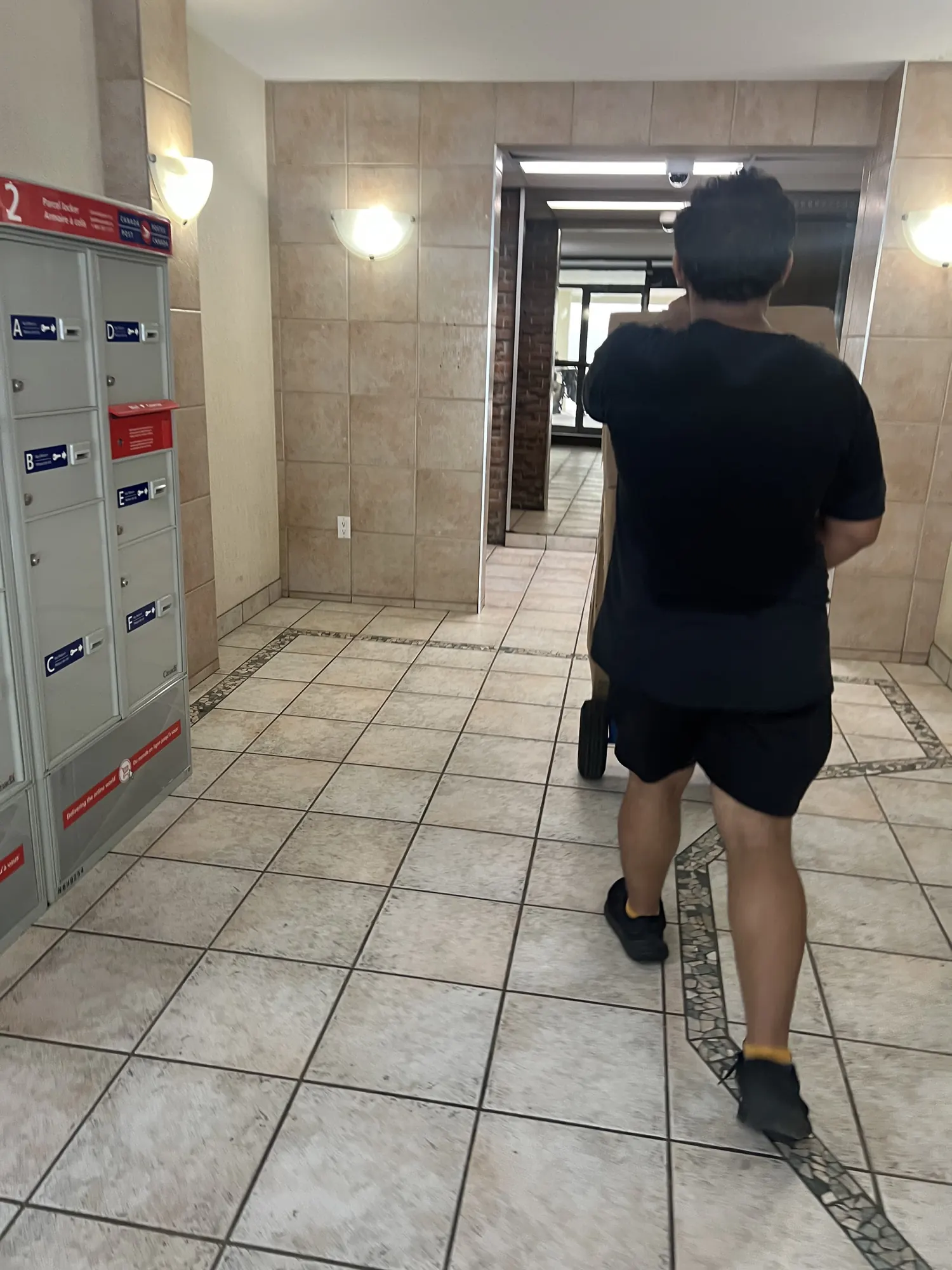 Labor only mover moving item through apartment building