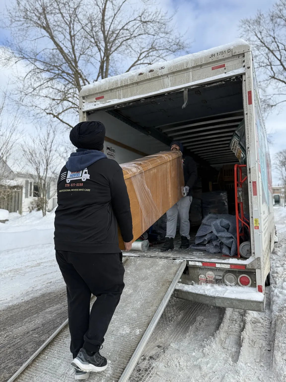 Labor only movers loading furniture in winter