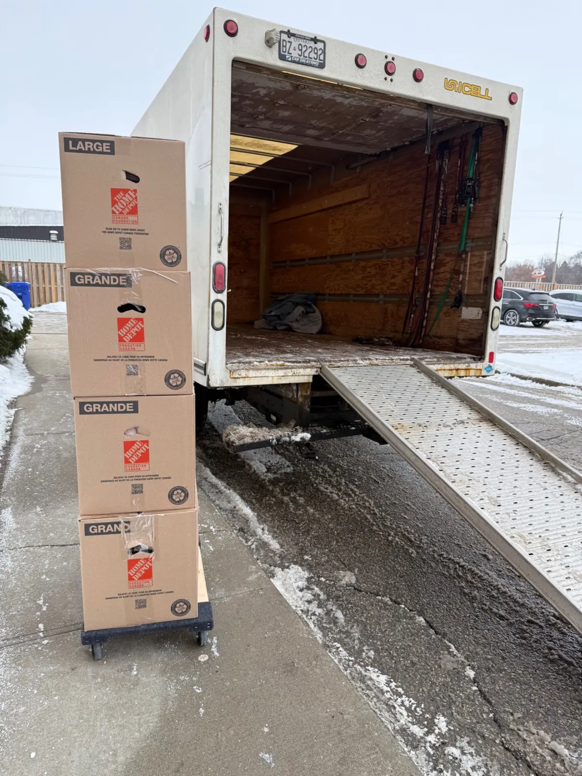 Apartment moving boxes beside truck ramp