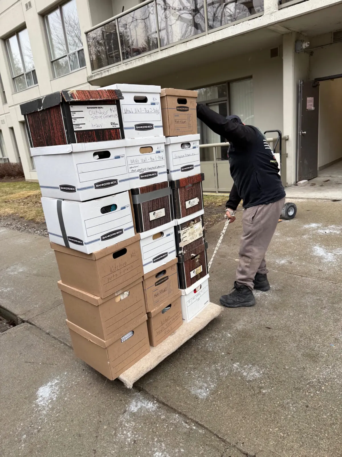 Boxes stacked on a custom apartment moving dolly