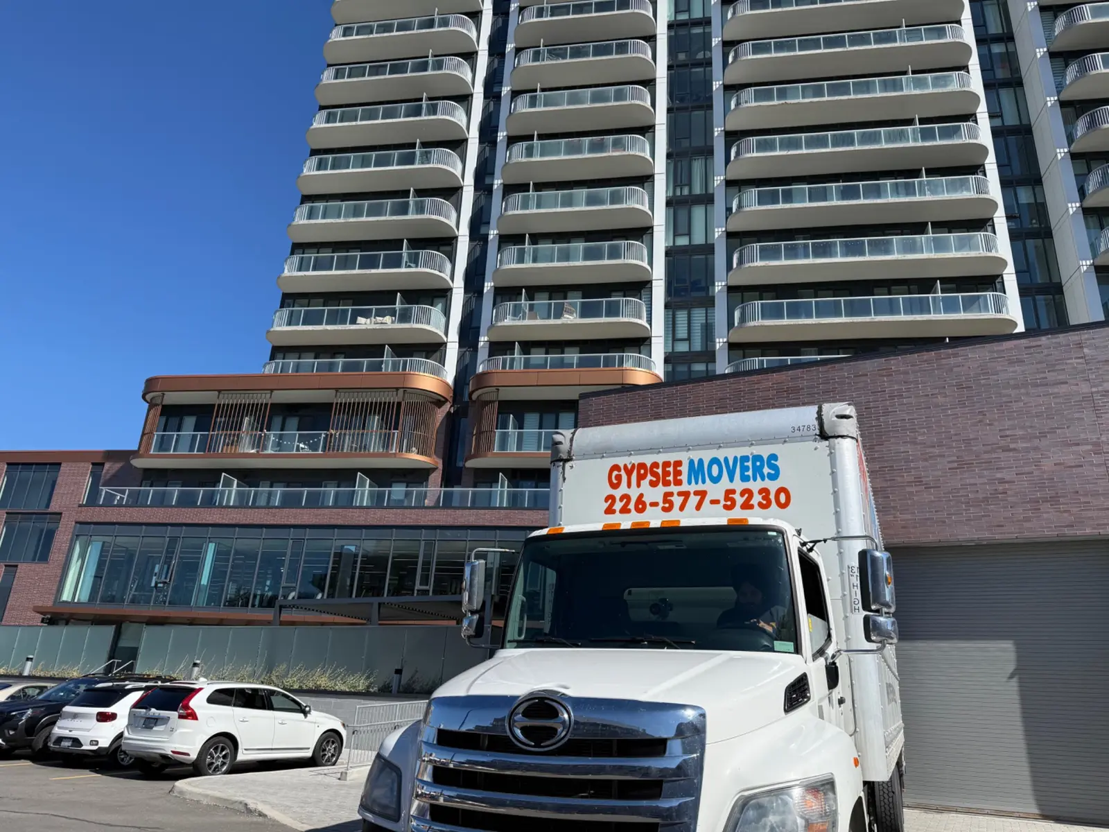 Gypsee Movers truck at a London Ontario condo building