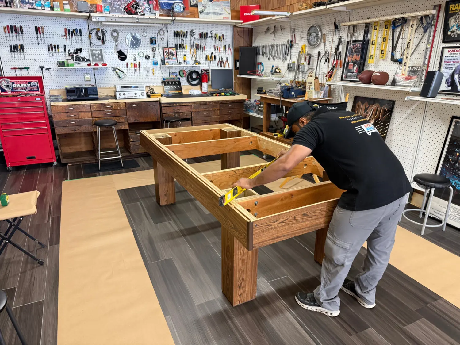 Gypsee Movers checking a disassembled pool table frame