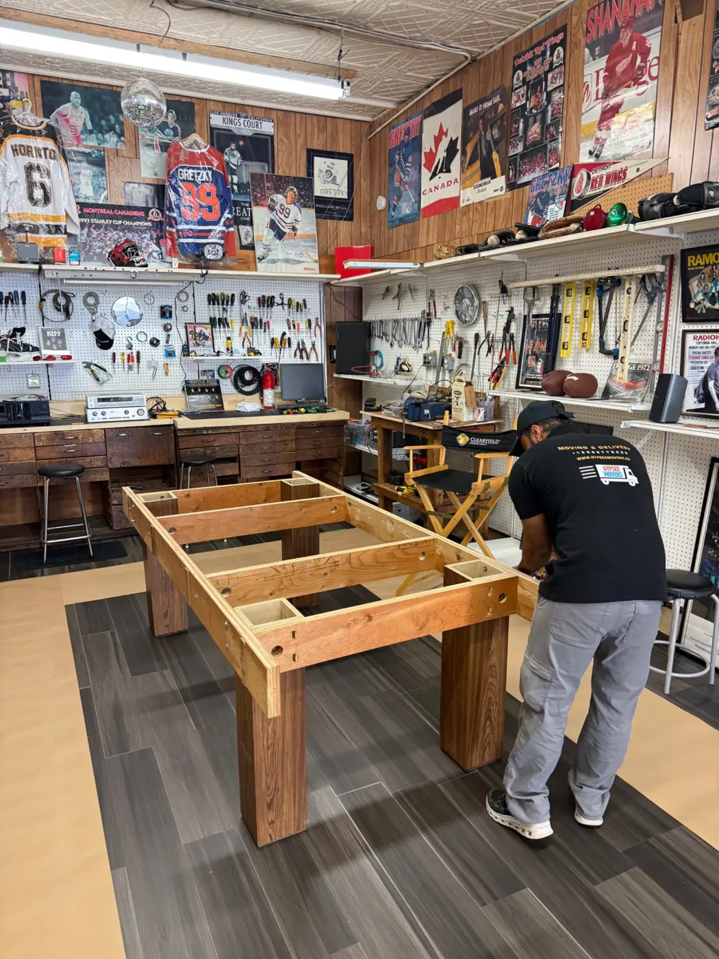 Pool table base frame disassembled for removal through tight access