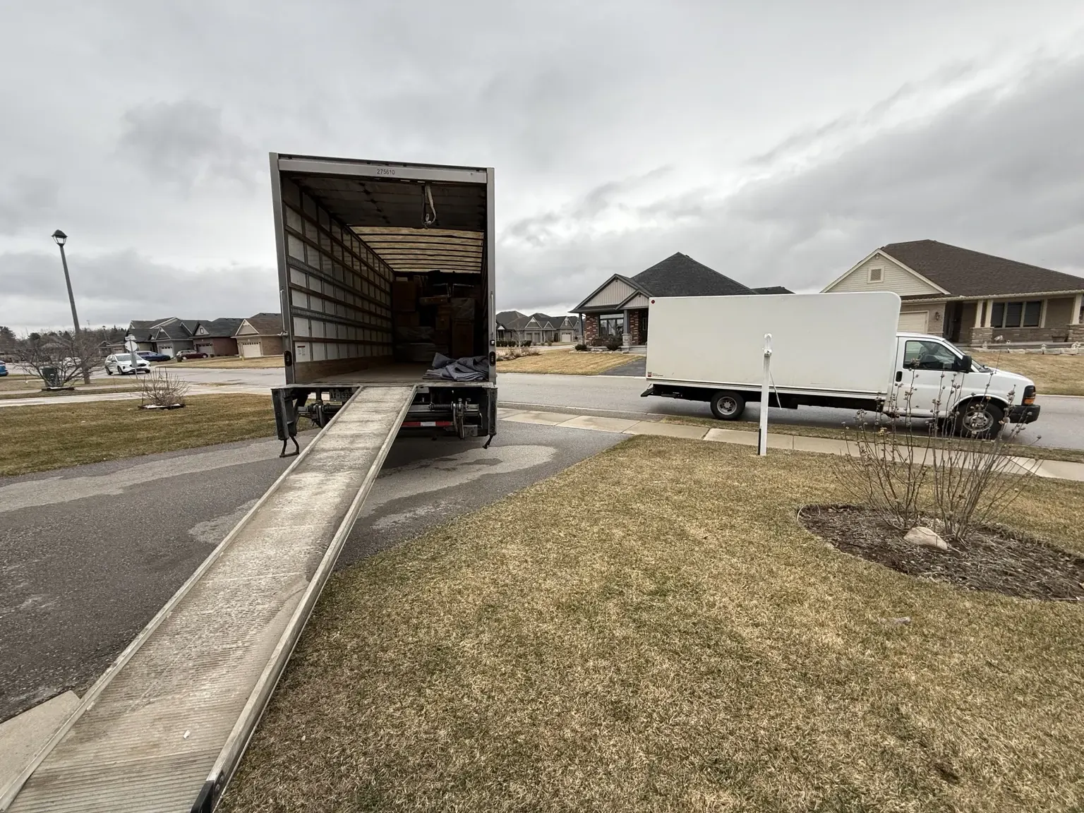 Moving truck ramp prepared for a long-distance move from a residential street