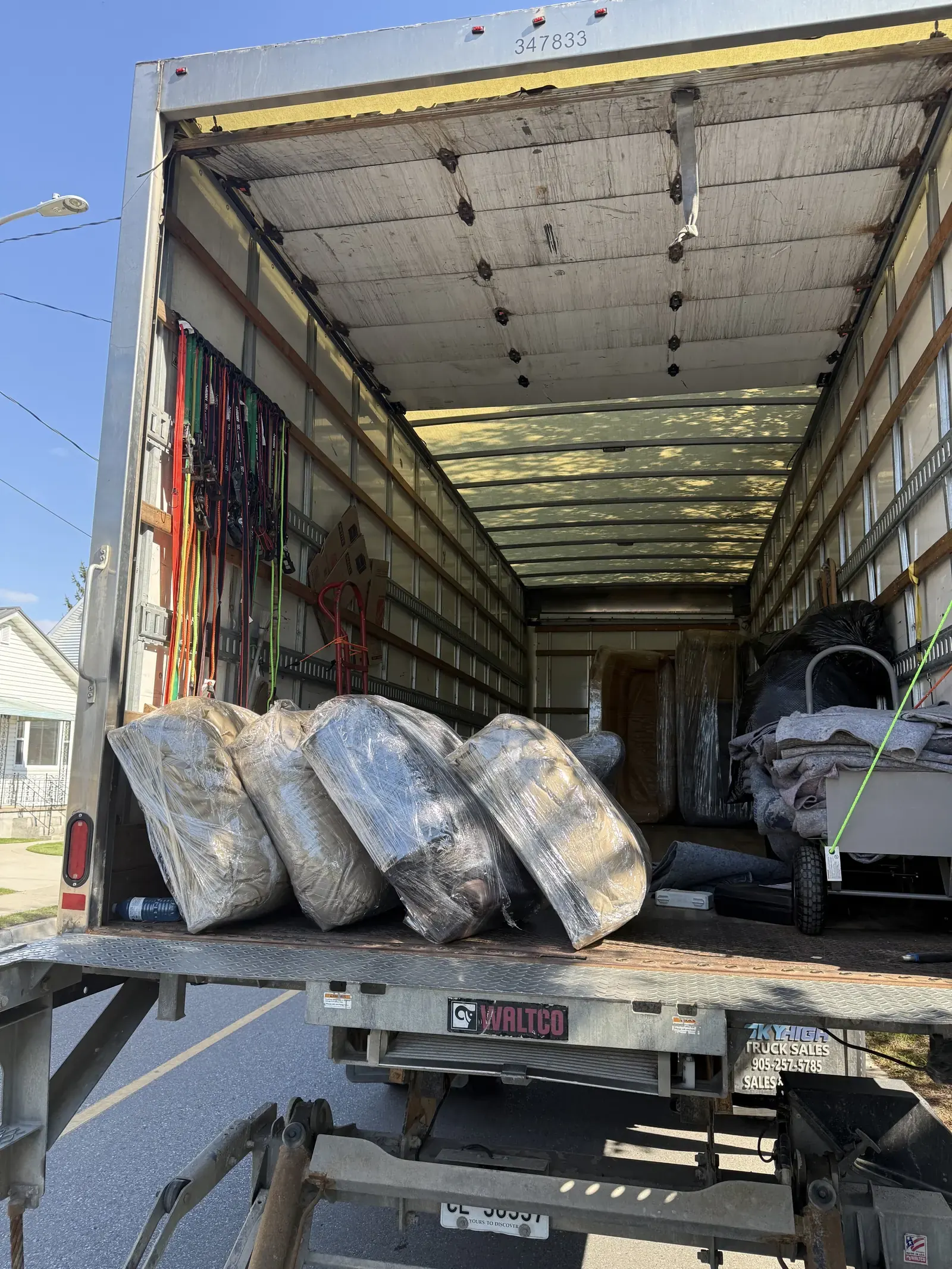 Packed long-distance moving truck with protected items secured inside