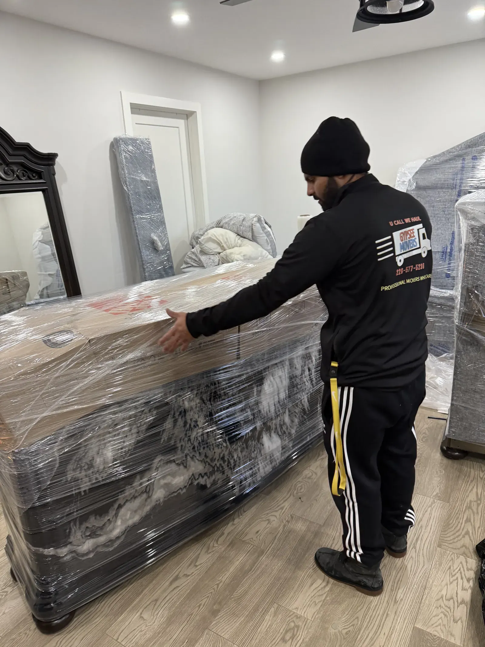 Large household item wrapped with stretch wrap before moving