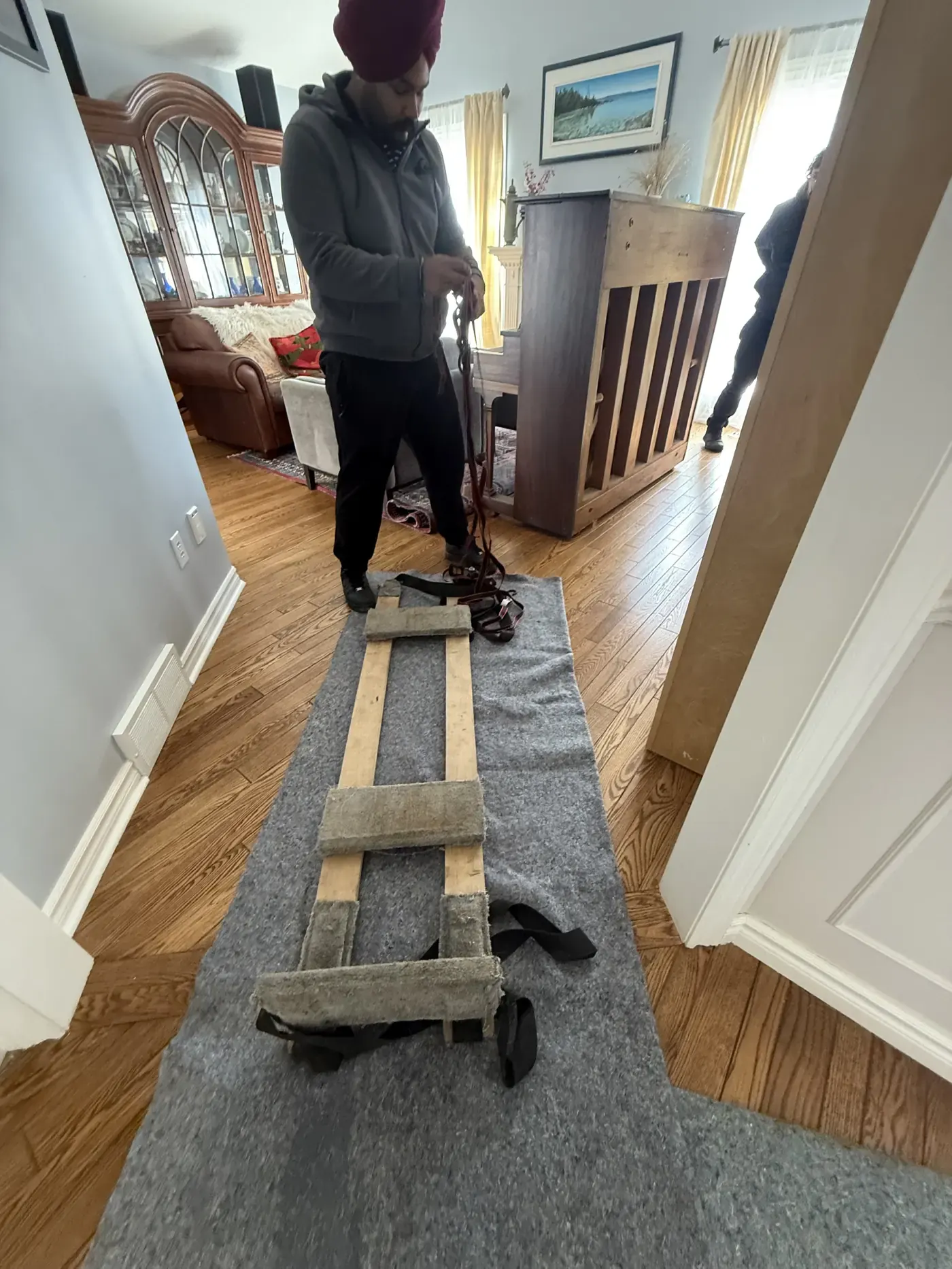 Special piano dolly and moving blankets prepared before moving a piano