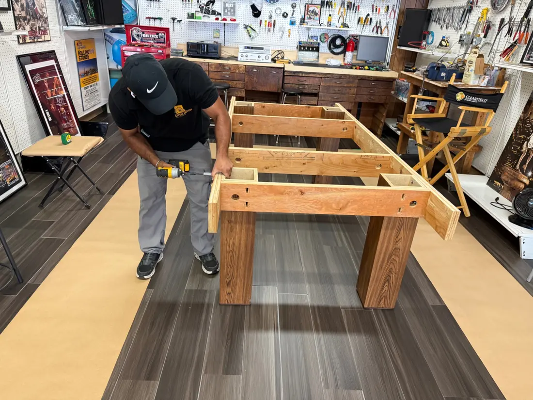 Technician assembling a pool table frame in Sarnia
