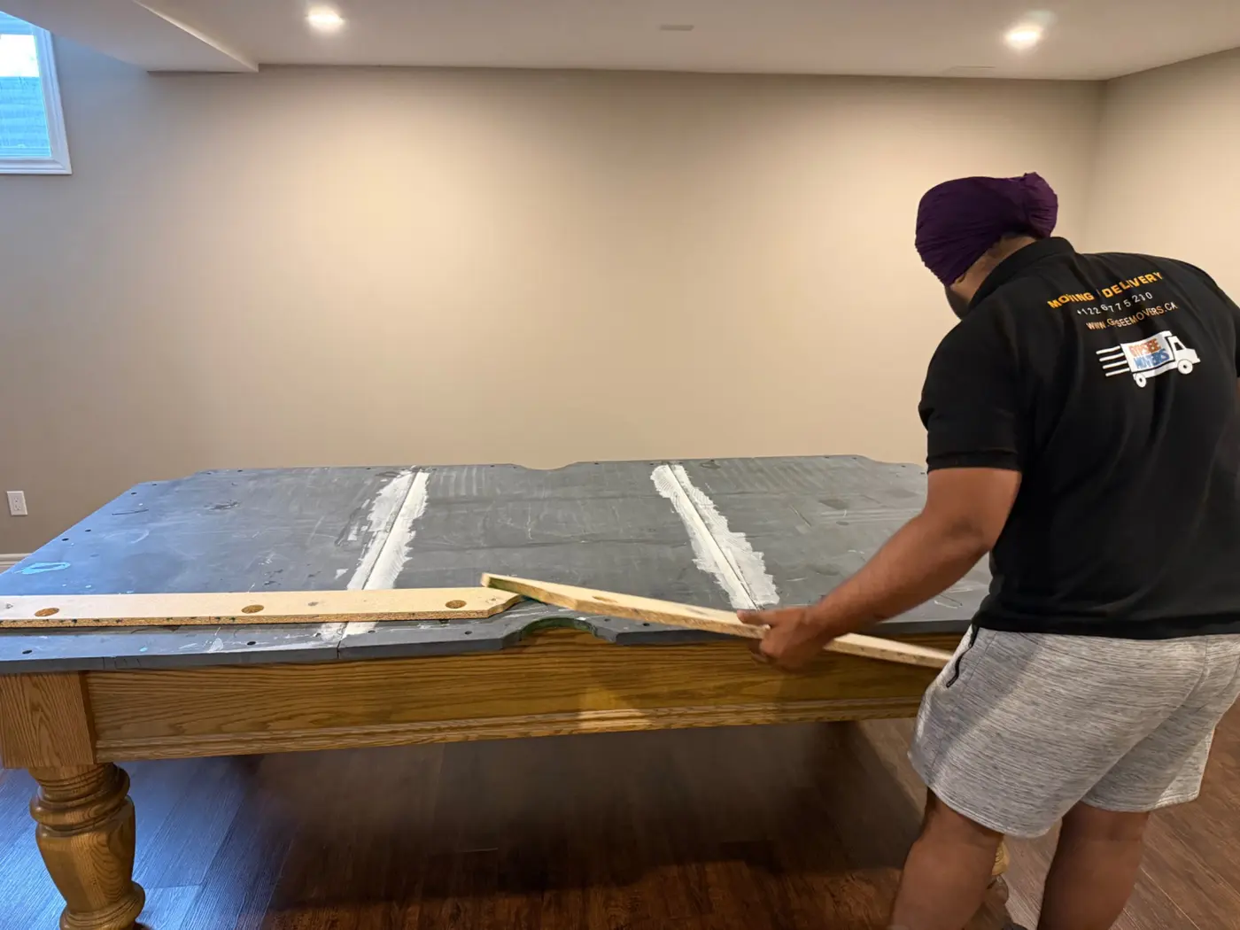 Pool table frame being prepared for slate