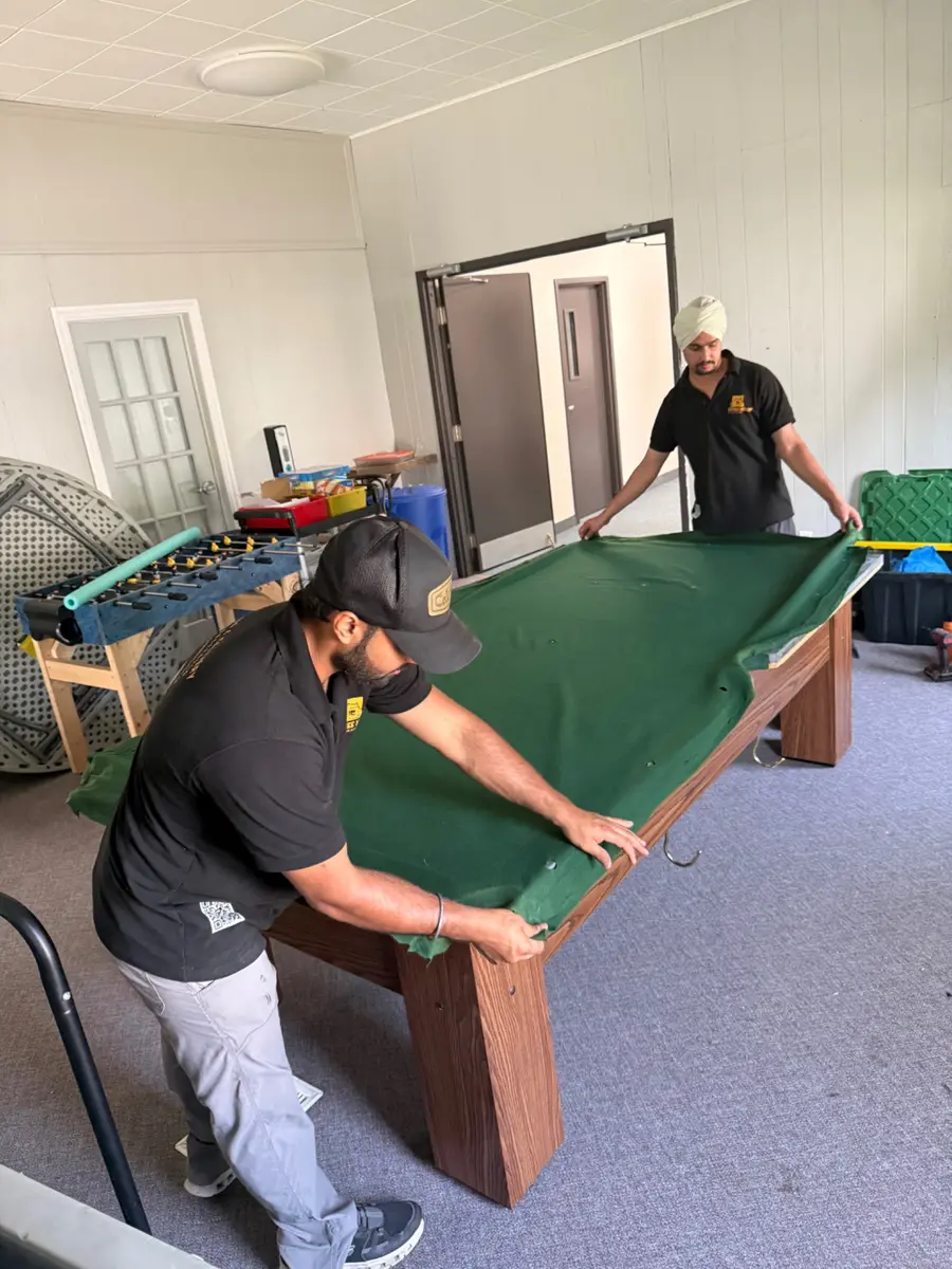 Positioning new green pool table felt