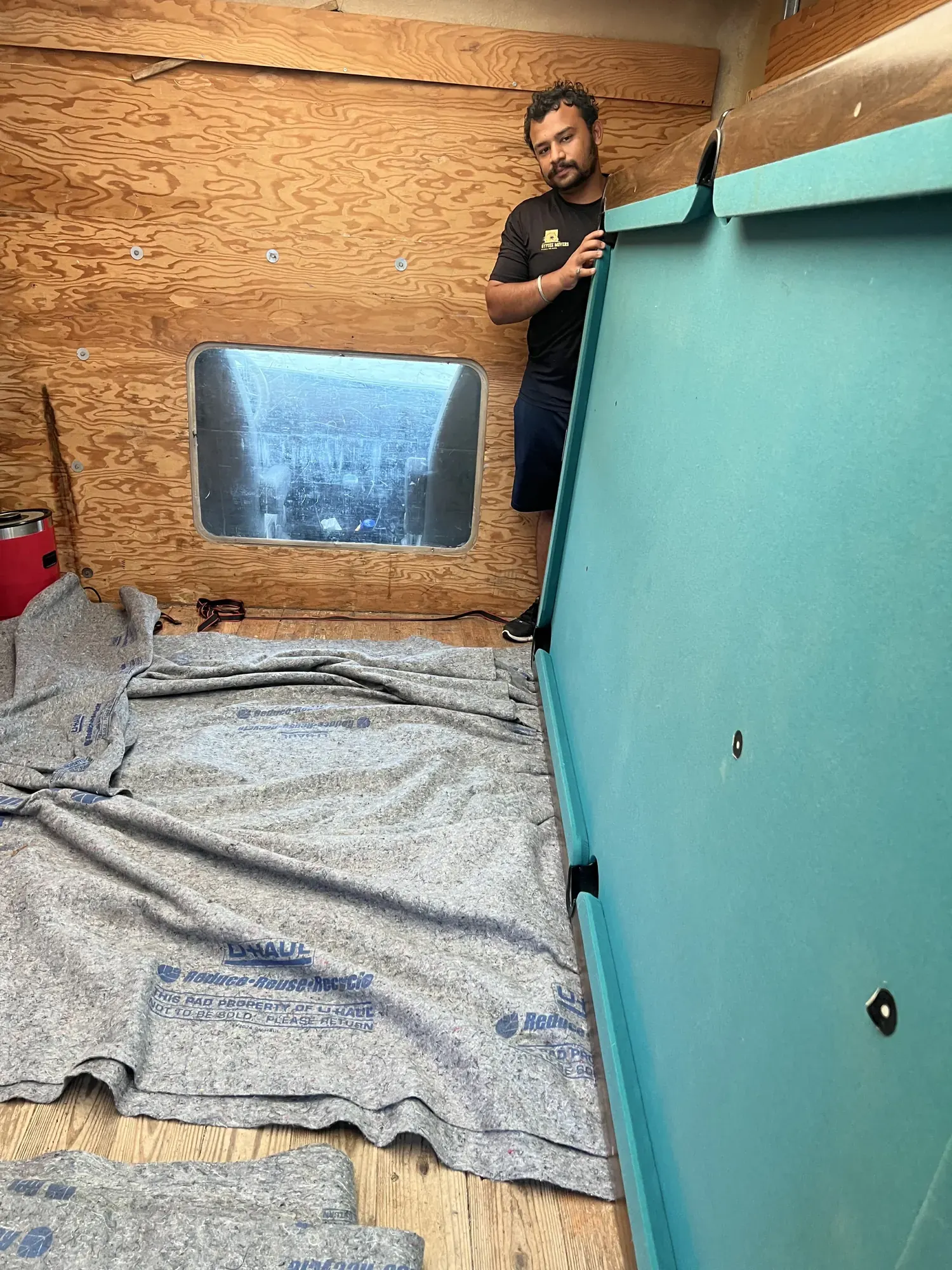 Gypsee Movers safely transporting a pool table inside the moving truck