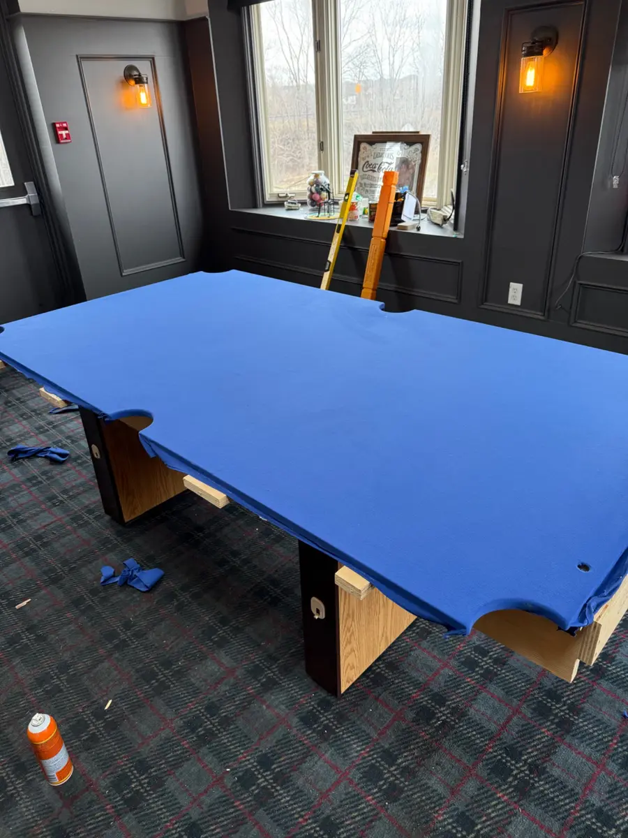 Blue billiard cloth fitted to slate