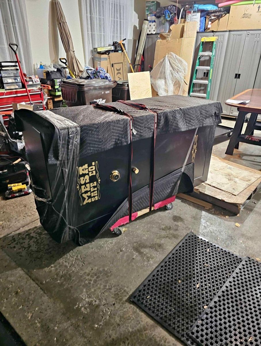 Heavy safe wrapped and strapped for specialty moving by Gypsee Movers
