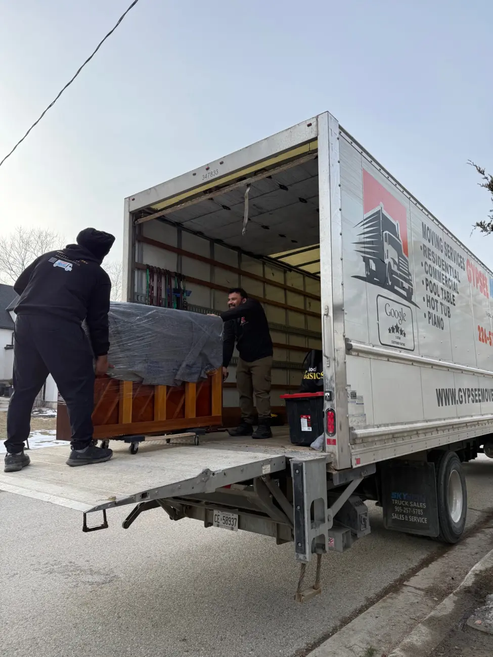 Upright piano entering the Gypsee Movers truck